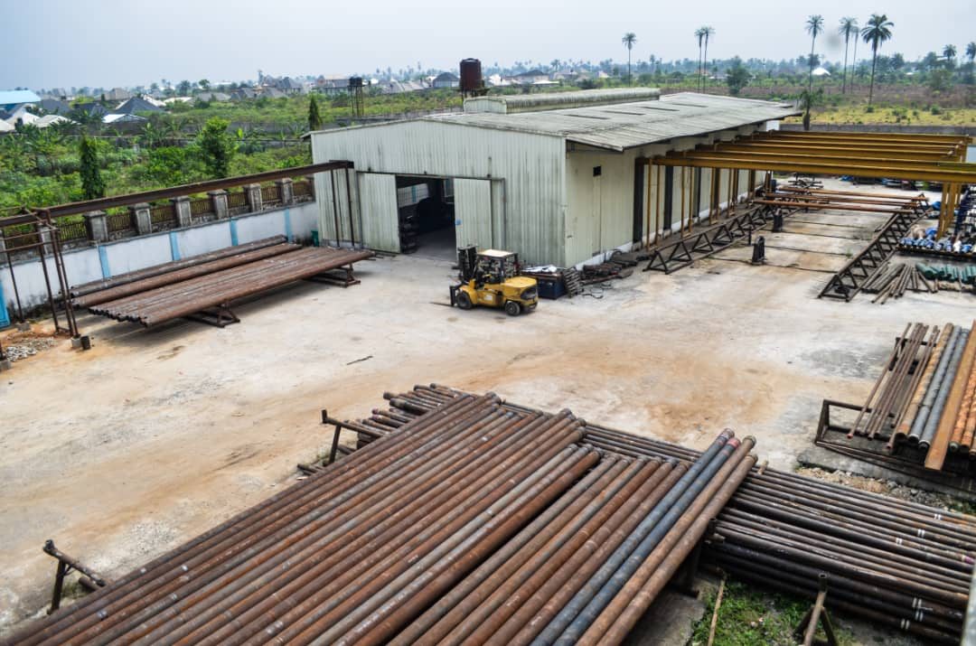 Elevated view of the Reveille workshop exterior and pipe yard